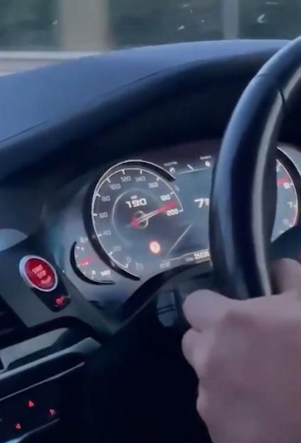 POV photo of a car's speedometer showing it exceeding 190 mph.