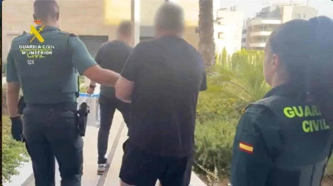 Spanish Civil Guard officers escorting former TV soap star Barry Philip Foster in Torrevieja.