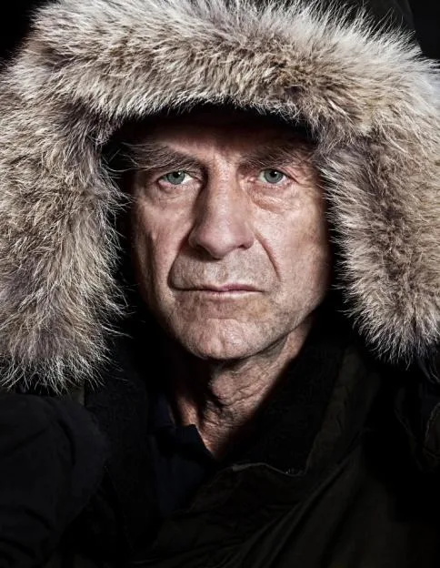 Close-up of Sir Ranulph Fiennes, an older man with blue eyes, wearing a fur-lined hood.