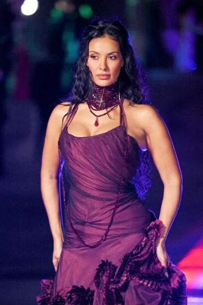 Maya Jama attends The British Museum Ball wearing a purple dress and matching jewellery.