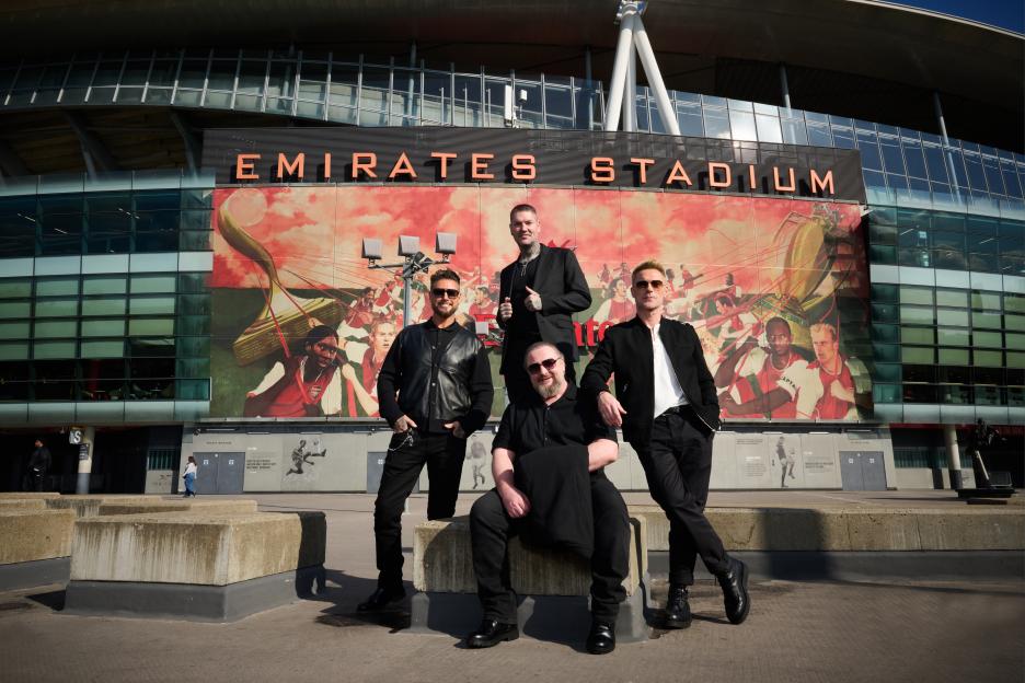 Boyzone posing in front of Emirates Stadium for their farewell tour.