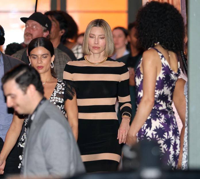 Jessica Biel on the set of "The Better Sister" wearing a black and nude striped dress.