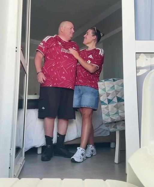 Becki Jones and Chris, her boyfriend, wearing matching red shirts.