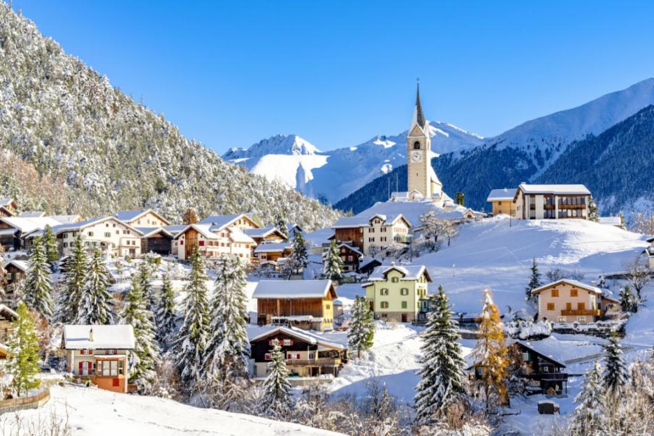 Alpine village in the Swiss Alps covered with snow.