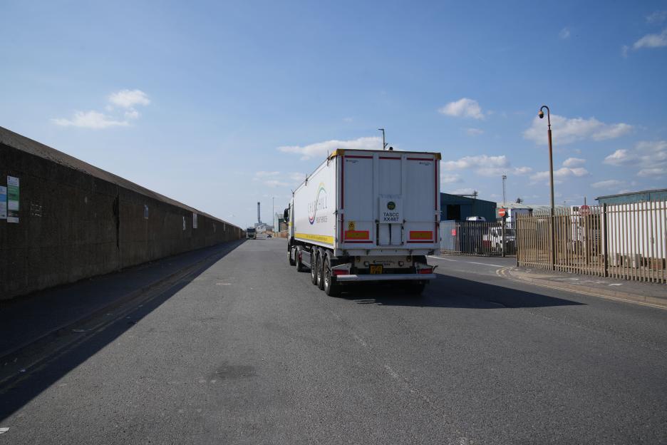 A Churchill Freight Services truck driving away from the camera.