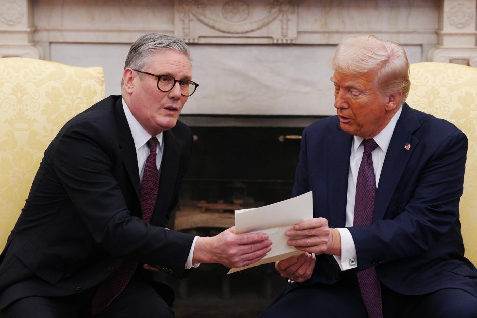 UK Prime Minister Keir Starmer handing an invitation to US President Donald Trump at the White House.