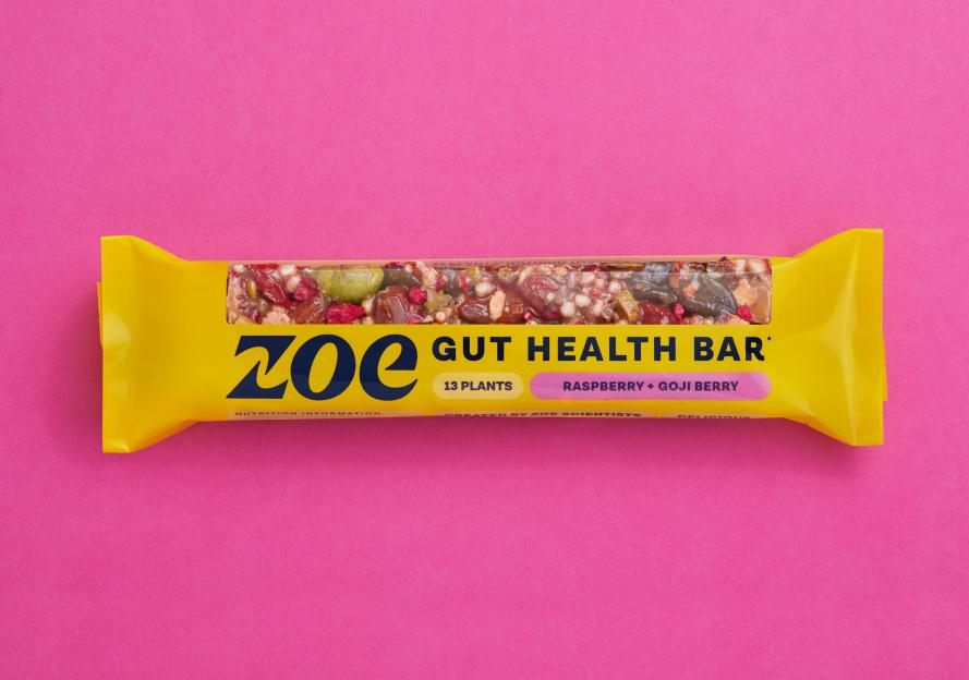A ZOE Gut Health Bar with raspberry and goji berry, on a pink background.