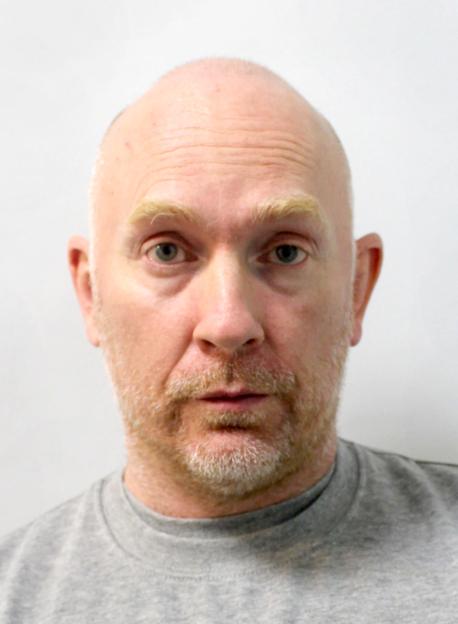 A close-up headshot of Wayne Couzens.