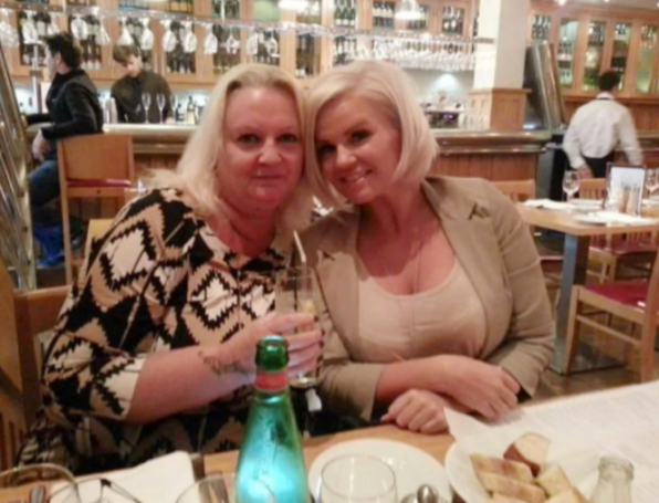 Kerry and Sue Katona seated at a restaurant table.