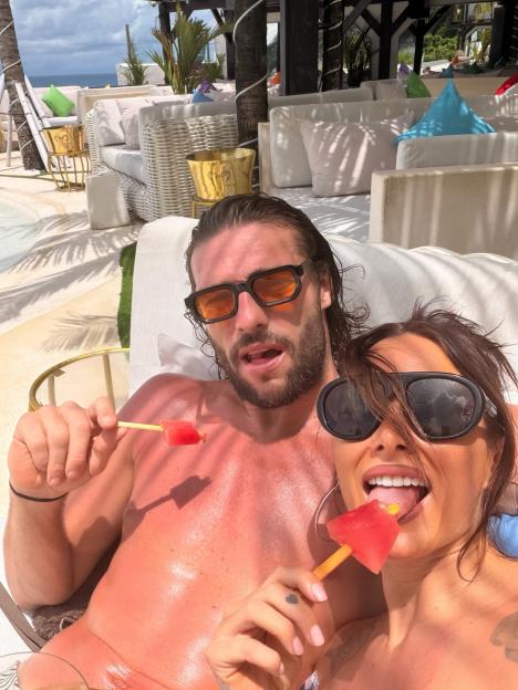 Andy Carroll and Lou Teasdale eating watermelon ice pops.