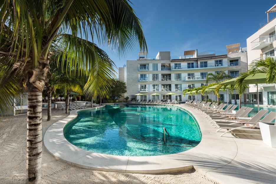 Swimming pool and hotel at the Essence at the Fives Beach hotel and TRS Yucatan hotel.