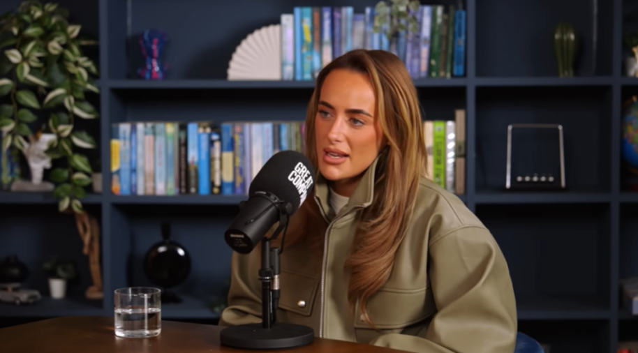 Millie Court speaking into a microphone.