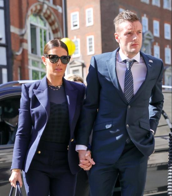 Rebekah and Jamie Vardy holding hands outside court.