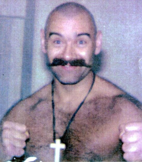 Charles Bronson, Britain's most notorious criminal, flexing his muscles.