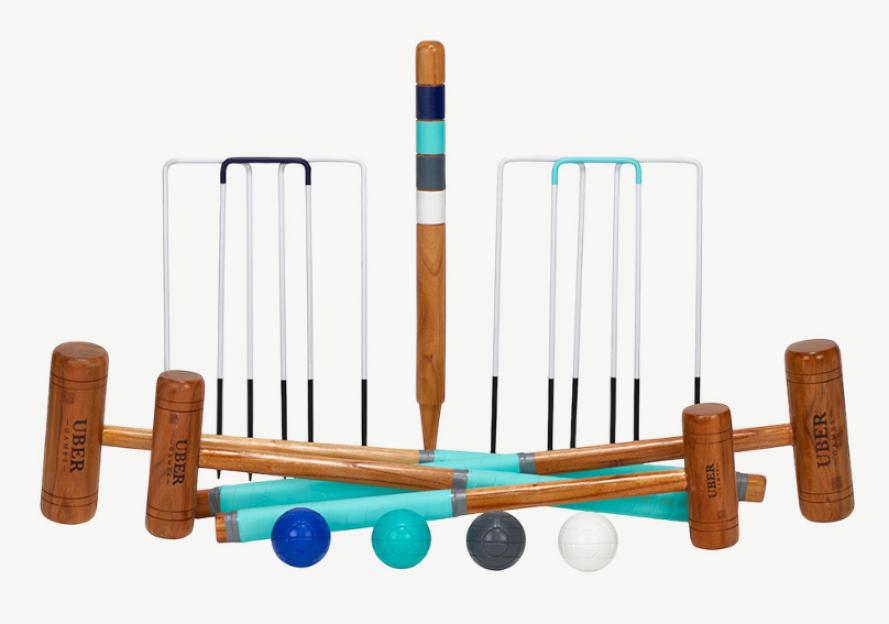 Croquet set with mallets, wickets, stakes, and balls.