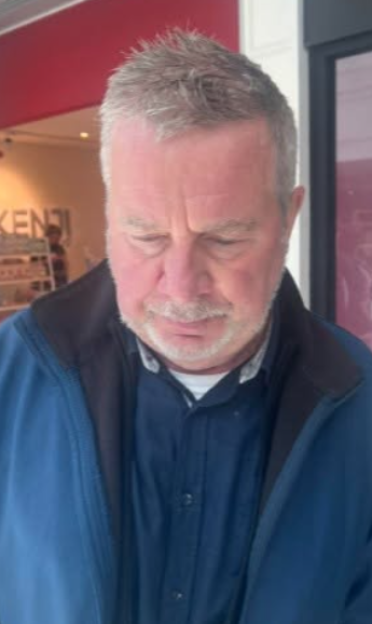 CCTV image of a man wanted in connection with an alleged voyeurism incident.