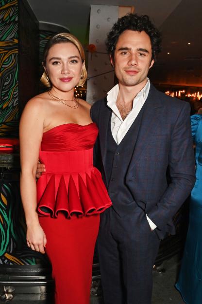 Florence Pugh in a red dress and Toby Sebastian in a suit at the 43rd London Critics' Circle Film Awards after party.