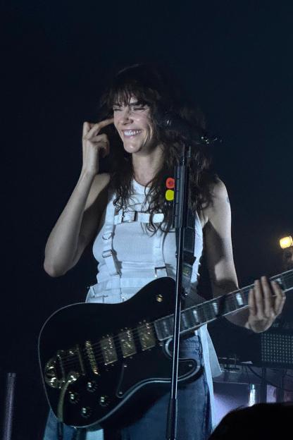 Cara Delevingne performing with a black guitar at Silent Green in Berlin.