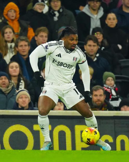 Adama Traoré in a Fulham jersey during a match against Nottingham Forest.