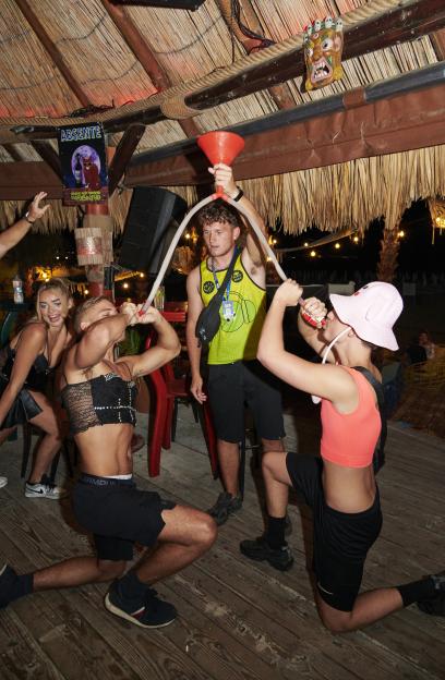 a group of people are playing a game called absentee