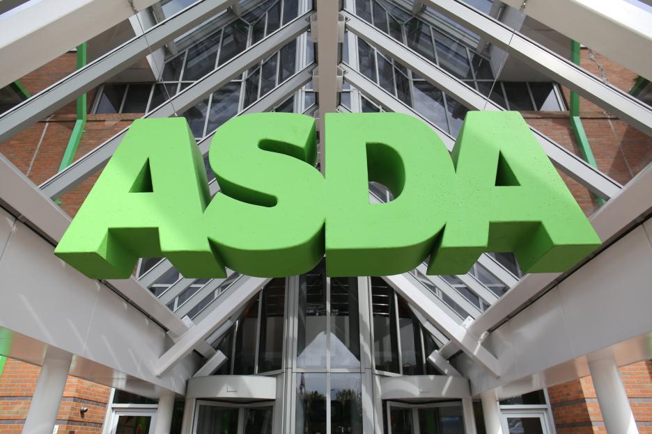 The Asda logo, in large green letters, is displayed prominently outside the supermarket's head office in Leeds.