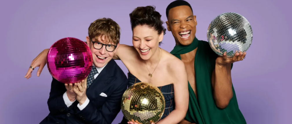 Three people smiling and holding disco balls against a purple background.