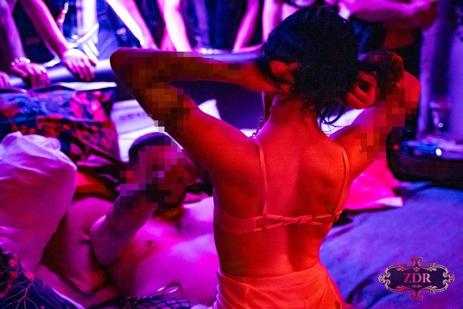 A couple enjoying a "Naughty Narnia" sex party in Brighton.