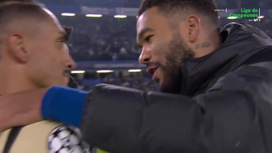 Raphinha and Reece James embracing after Chelsea's victory over Barcelona.