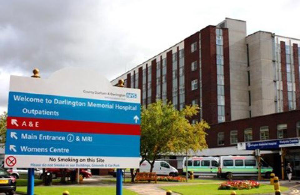 Darlington Memorial Hospital entrance with a large directional sign.