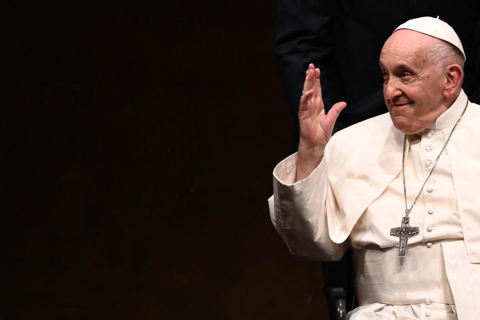 Pope Francis gestures while attending a meeting in Lisbon.