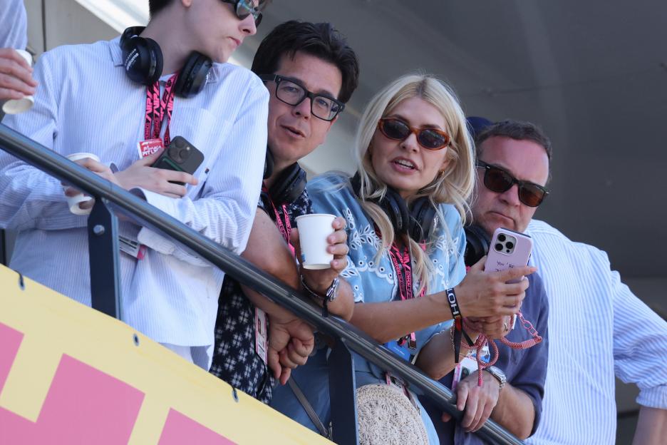 Michael McIntyre, Holly Willoughby, and another man wearing sunglasses watching the Monaco F1 Grand Prix Qualifying.
