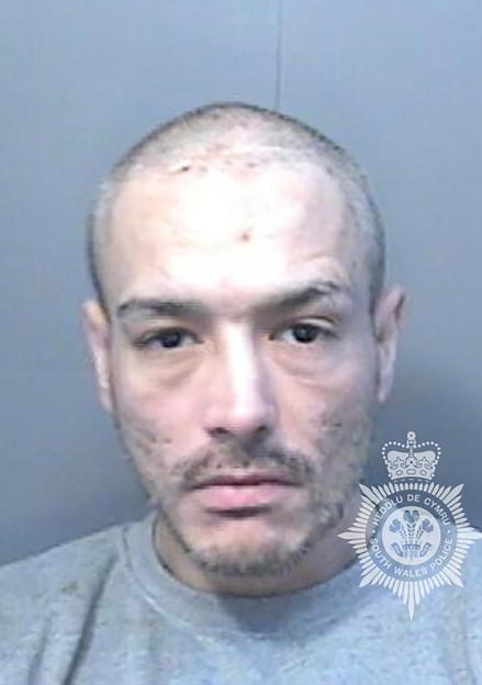 Mugshot of Darren Steel, a man with a shaved head and light stubble.