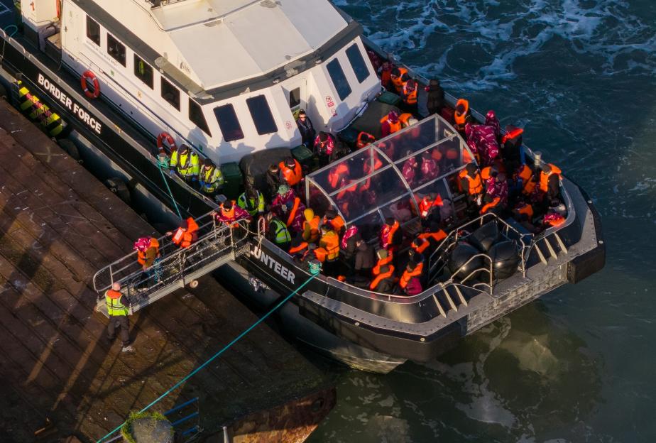 Migrants disembarking from a Border Force vessel at Ramsgate port.