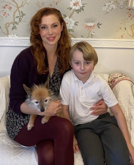 Annette Kellow, her son Felix, and their dog sitting together.