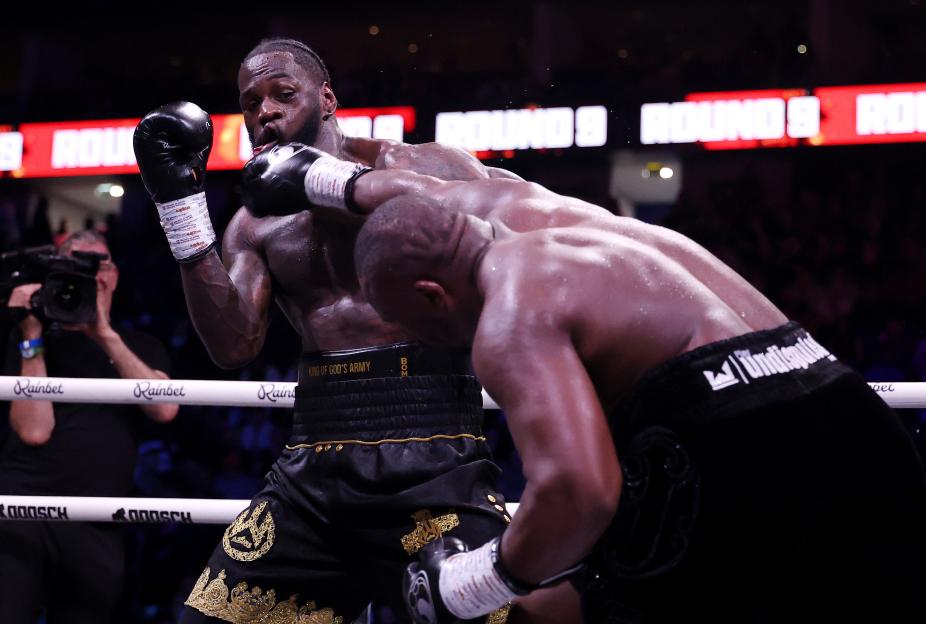 Dereck Chisora punches Deontay Wilder during their heavyweight fight at The O2 Arena.