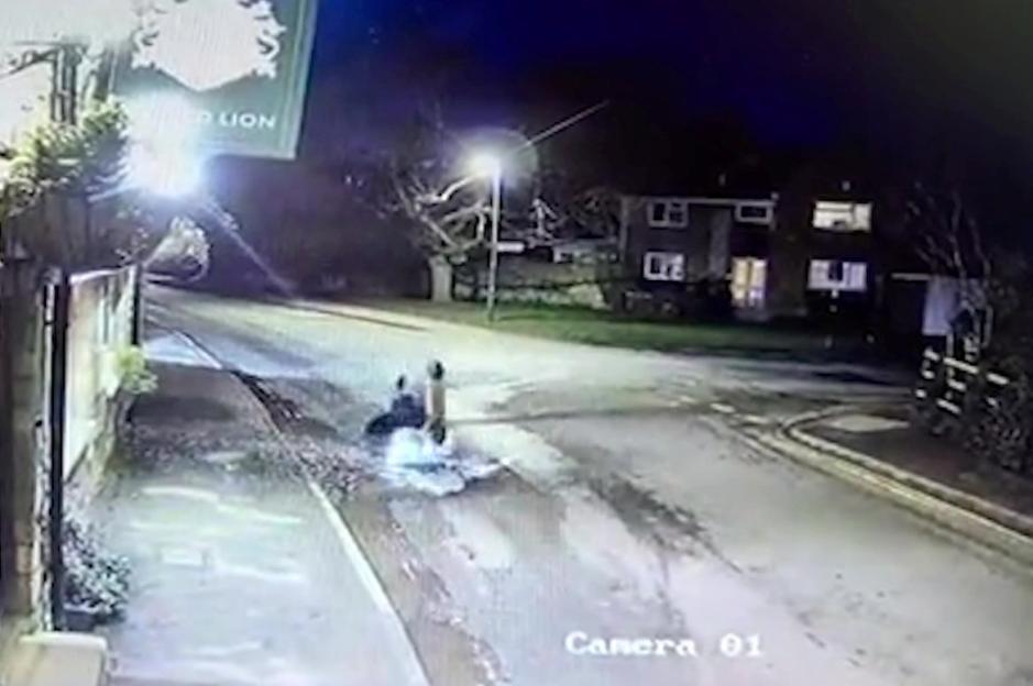 CCTV footage of an e-scooter rider face-planting into the road after hitting a large pothole.