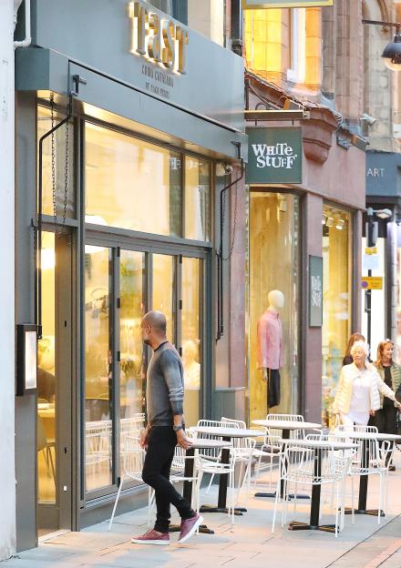 Pep Guardiola entering TAST restaurant.