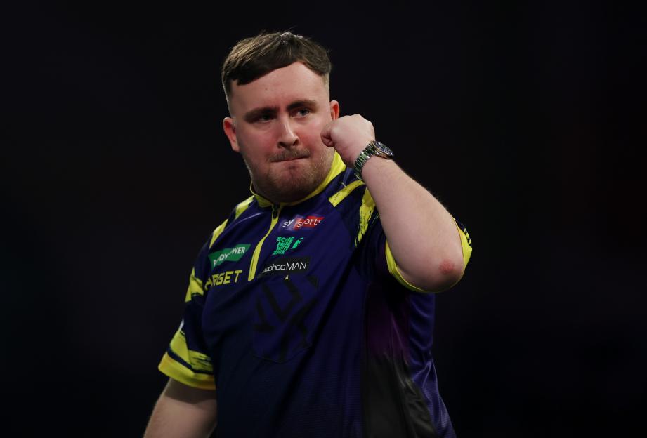 Luke Littler of England reacts during his semi-final match against Ryan Searle.