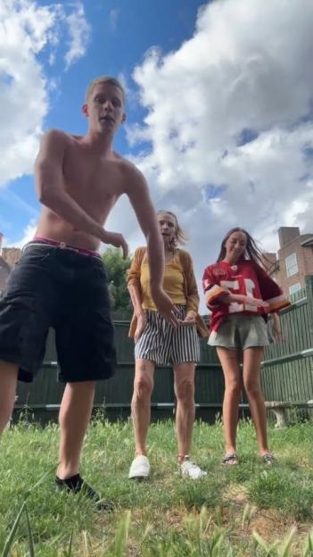 Freddy Brazier dancing with his grandmother Jackiey and another young woman.