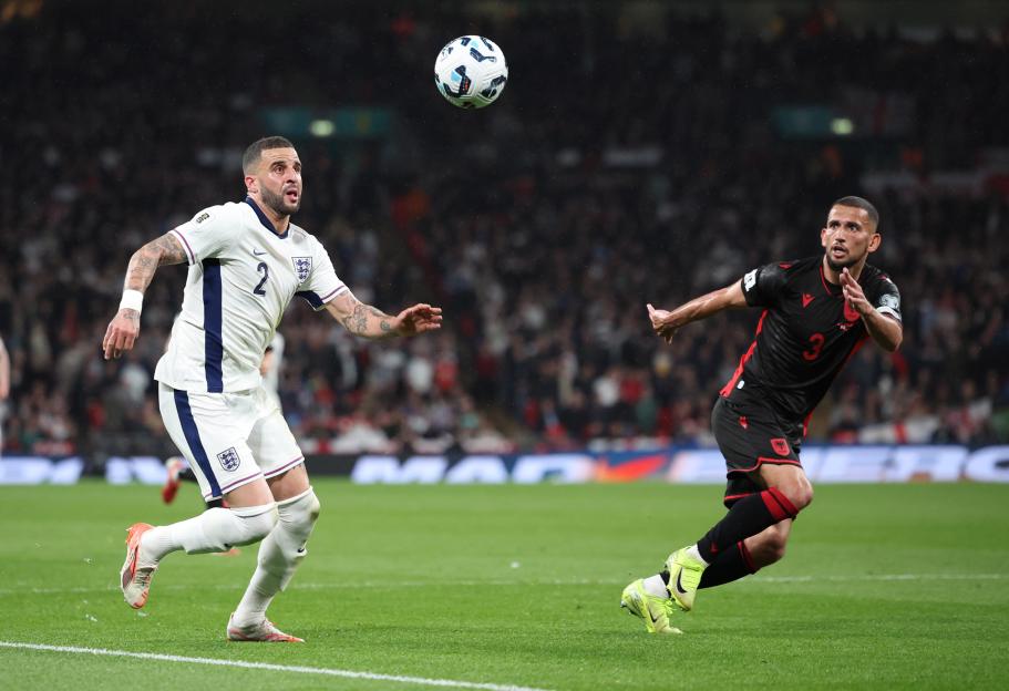 Kyle Walker of England and Dan Burn of Albania playing in a World Cup 2026 Qualifier match.