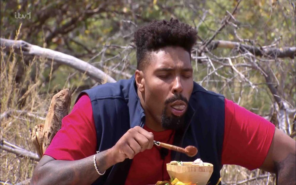 Jordan Banjo eating during a challenge on "I'm A Celebrity… South Africa."