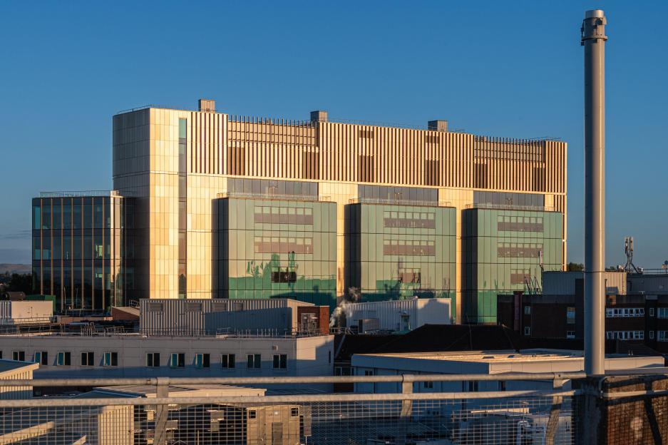 The Christie Hospital, a single-site cancer center in Didsbury, Manchester, England, at golden hour.