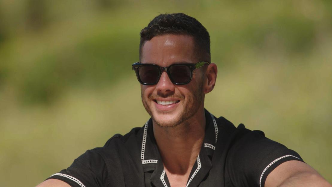 Scott Thomas speaking into a microphone.