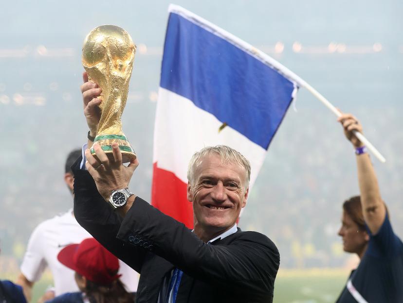 Didier Deschamps holds up the World Cup trophy.