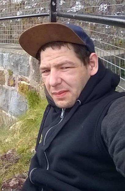 Kyle Bevan, accused of murdering two-year-old Lola James, wearing a cap and black hoodie.