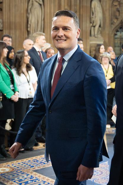 Britain's Health Secretary Wes Streeting walking through the Houses of Parliament.