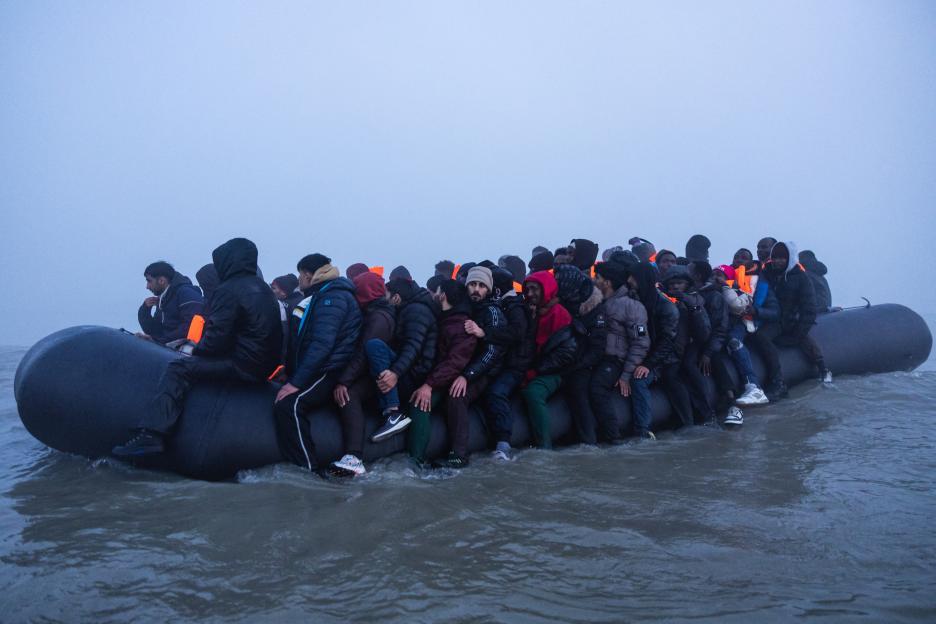 Migrants crowded onto a rubber boat attempting to cross the English Channel.
