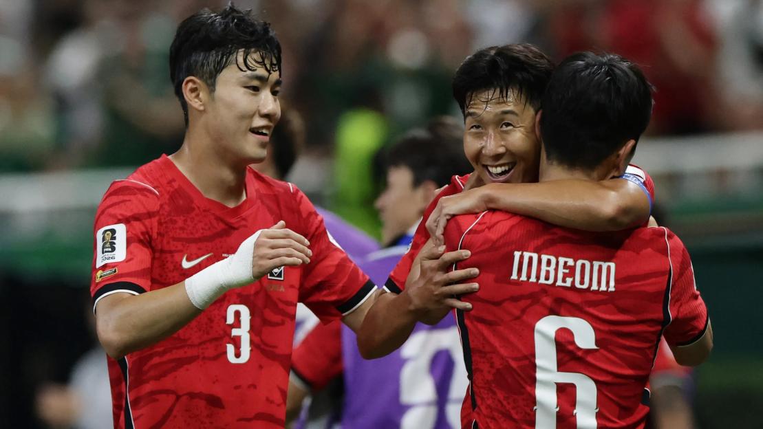 South Korean soccer players Hwang In-beom, Son Heung-min, and Lee Gi-hyeok celebrate a goal.