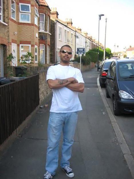 Leon Sosseh standing on a sidewalk.