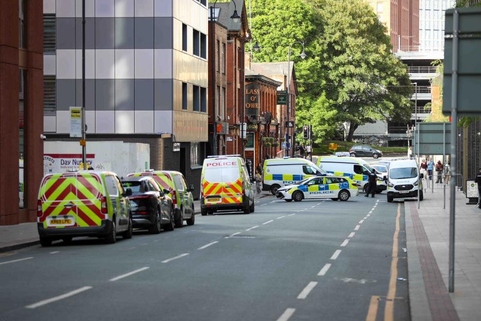 Police vehicles on Charles Street in Manchester City Centre following a serious incident.